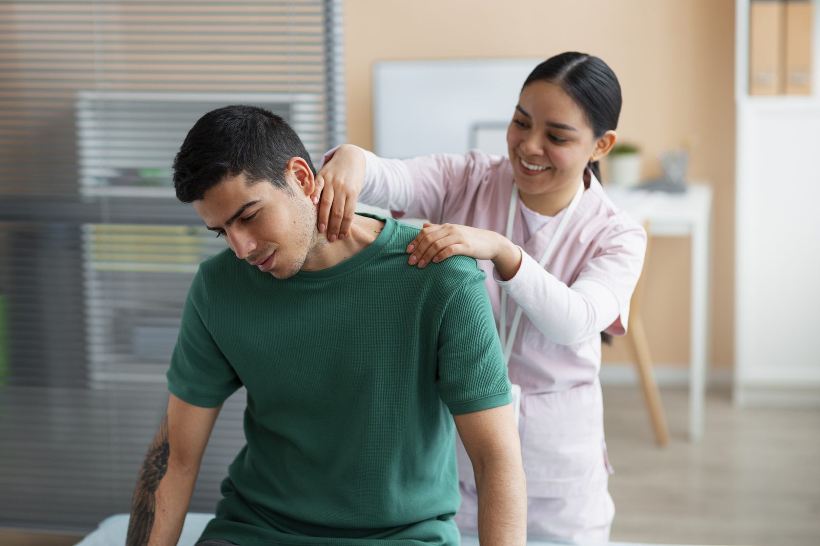 Physiotherapist guiding a patient through a personalized leg exercise
